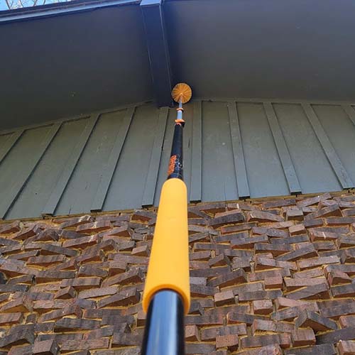 Spider Web Removal De-Webbing a home's eaves